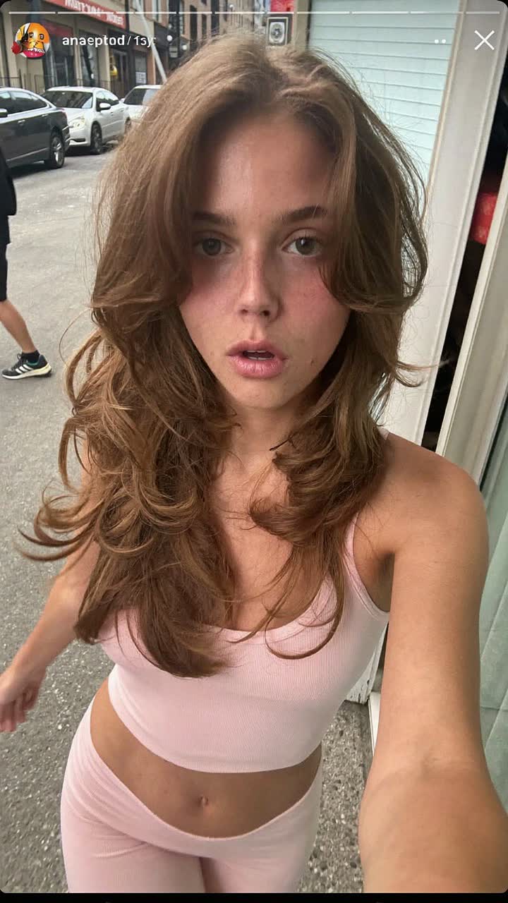 Chloe, 28-year-old white American woman, glossy layered hair, wearing a soft pink matching lounge set