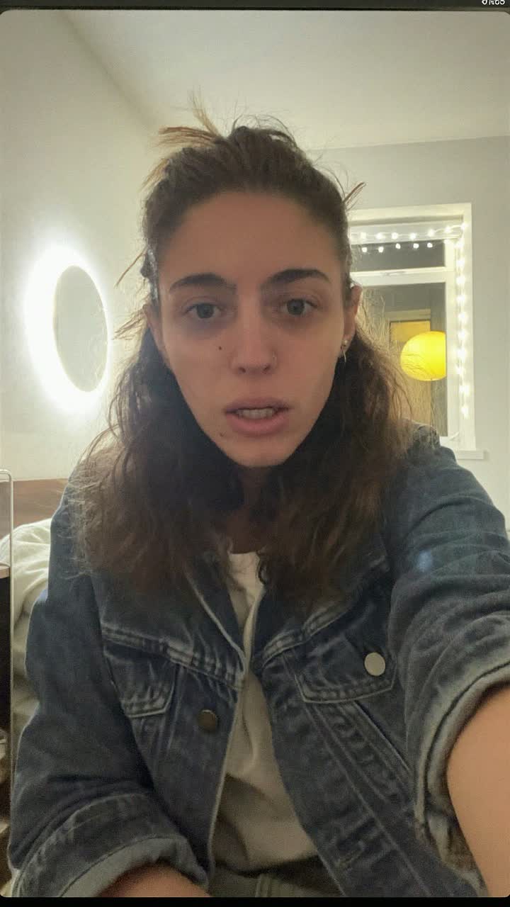 Francesca, 33-year-old Italian woman, half-up half-down hairstyle, wearing a denim jacket over a white tee