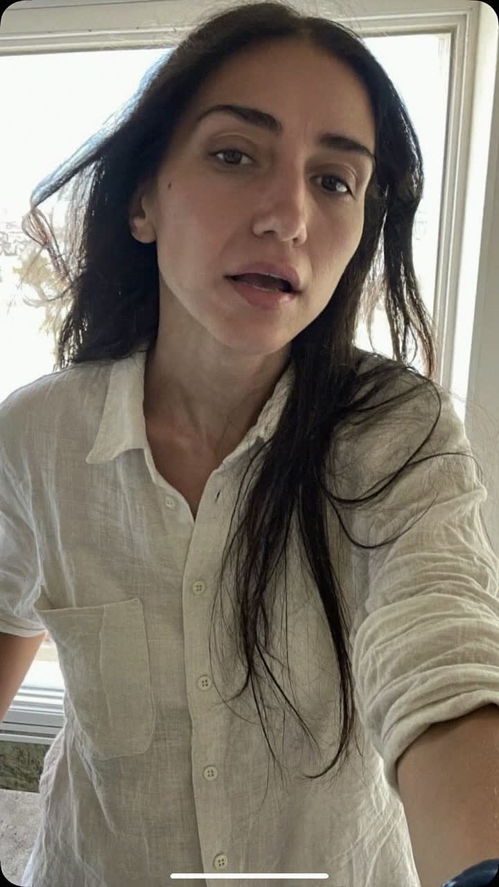 Inés, 33-year-old Spanish woman, long straight dark hair, wearing a linen button-down