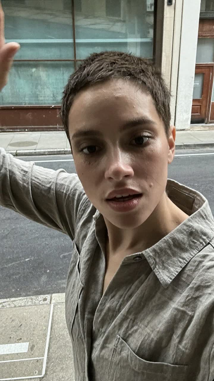Malia, 29-year-old Native Hawaiian woman, pixie cut, wearing a linen button-down