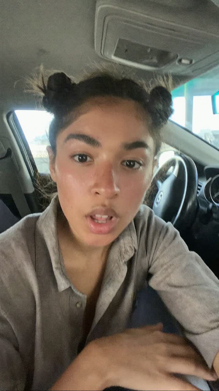 Sofía, 29-year-old Mexican woman, space buns, wearing a linen button-down